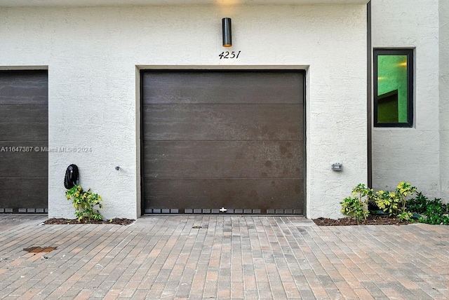 property entrance with a garage