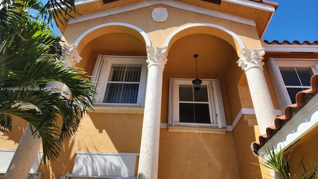 property entrance with stucco siding