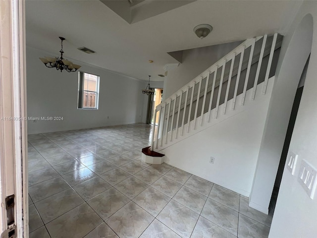 interior space with visible vents, tile patterned floors, and a notable chandelier