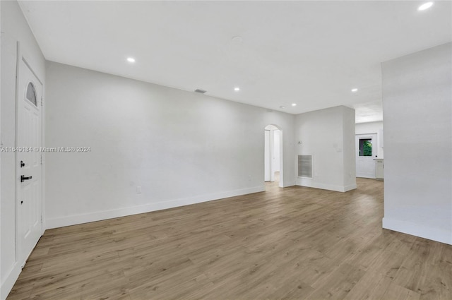 unfurnished living room featuring light hardwood / wood-style floors