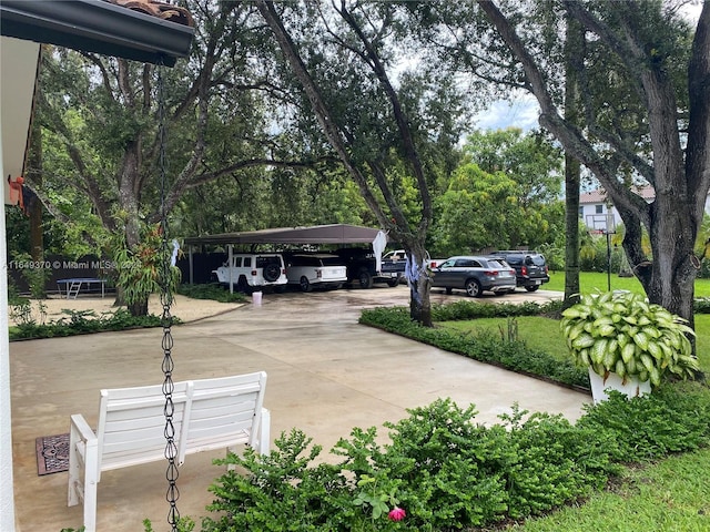 24490 SW 120th Ave, Homestead, FL 33032 - view of vehicle parking featuring a detached carport and driveway