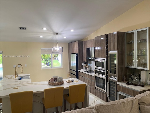 24490 SW 120th Ave, Homestead, FL 33032 - kitchen with a sink, freestanding refrigerator, beverage cooler, light countertops, and recessed lighting