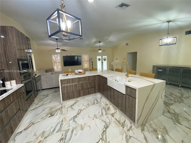 24490 SW 120th Ave, Homestead, FL 33032 - kitchen featuring open floor plan, stainless steel oven, vaulted ceiling, a ceiling fan, and a sink
