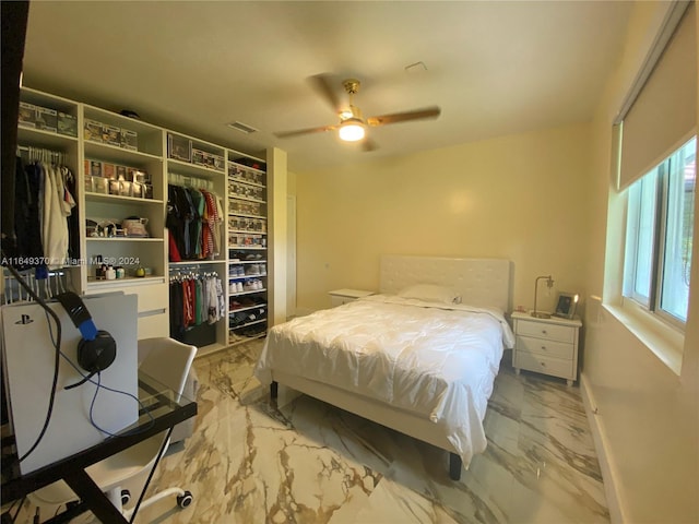 24490 SW 120th Ave, Homestead, FL 33032 - bedroom with marble finish flooring, a closet, a ceiling fan, and baseboards