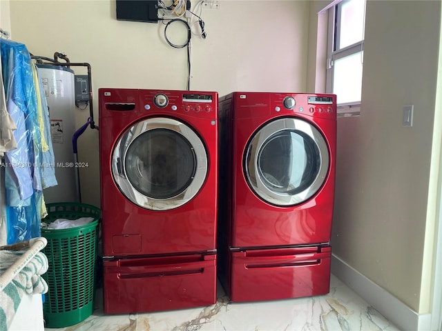 24490 SW 120th Ave, Homestead, FL 33032 - washroom featuring water heater, independent washer and dryer, marble finish flooring, and baseboards