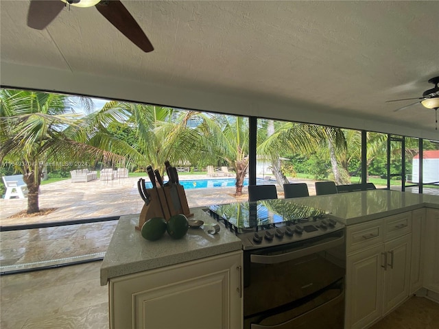 24490 SW 120th Ave, Homestead, FL 33032 - kitchen with a ceiling fan and electric stove