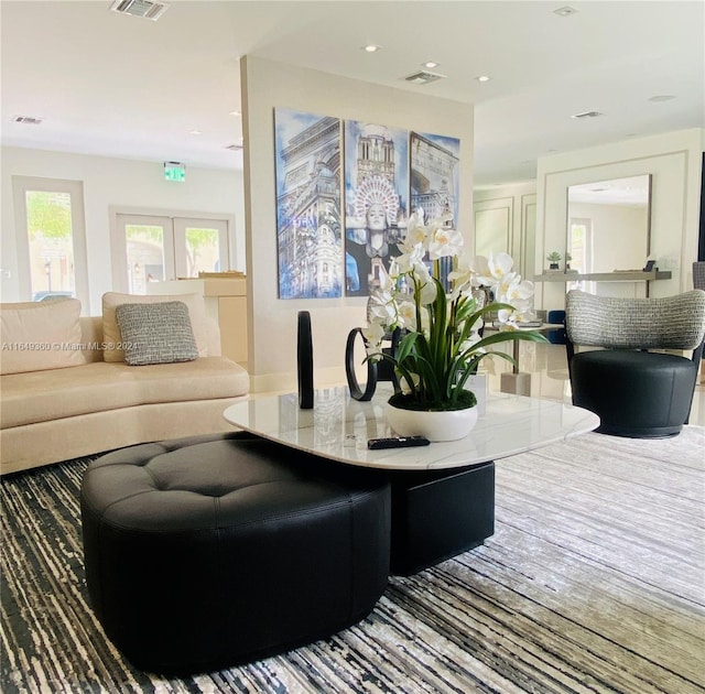 living area featuring recessed lighting and visible vents