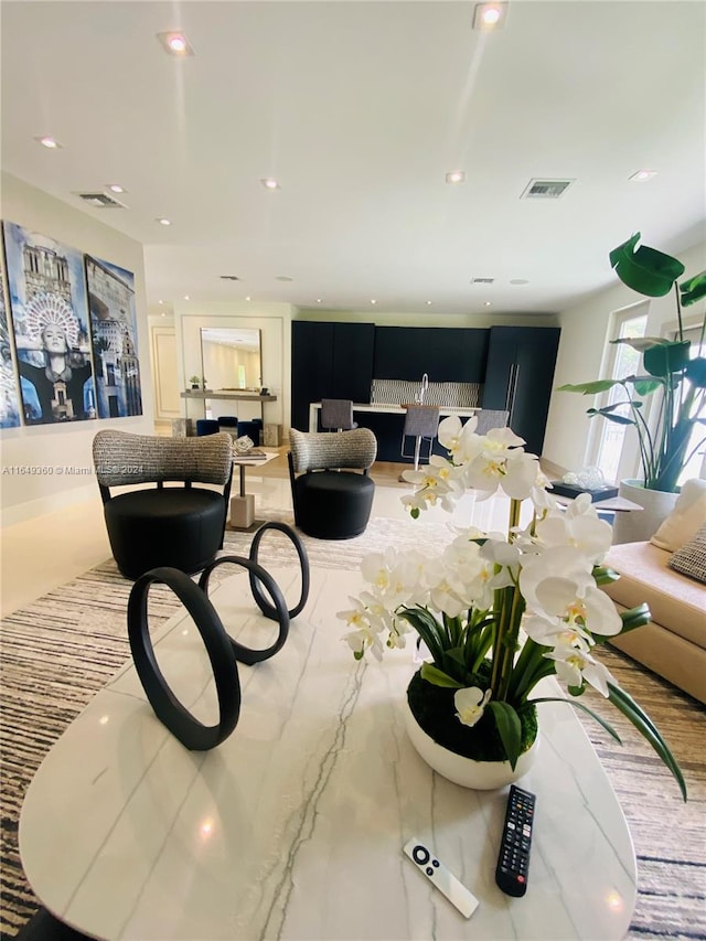 living room with recessed lighting and visible vents