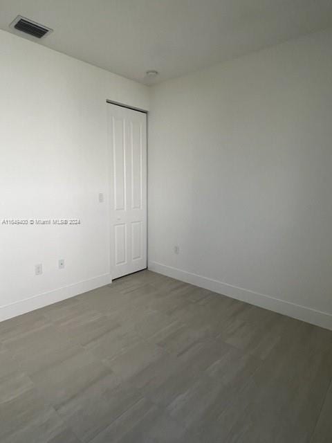 spare room featuring dark hardwood / wood-style floors