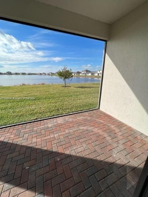 view of patio / terrace featuring a water view