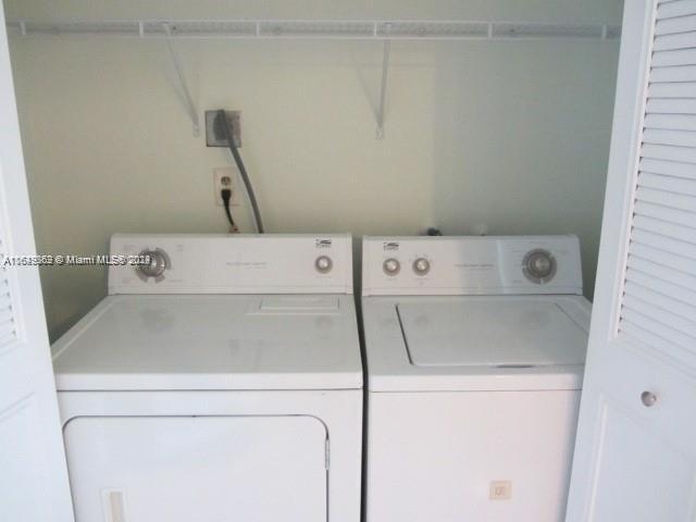 laundry room featuring washer and clothes dryer