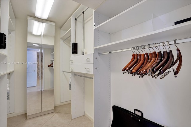 walk in closet featuring light tile patterned floors