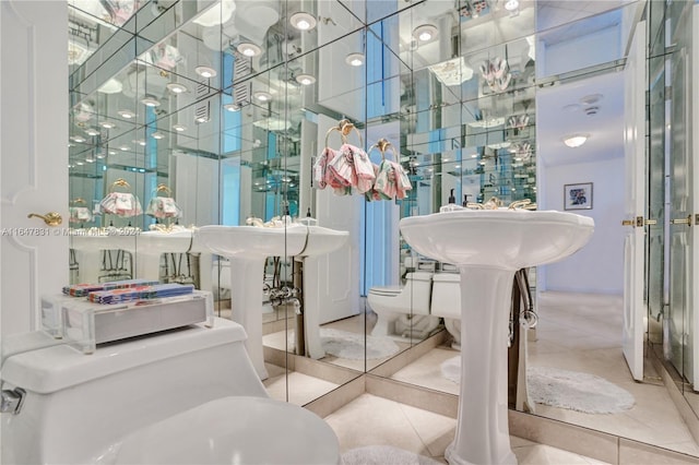 bathroom featuring toilet and tile patterned floors