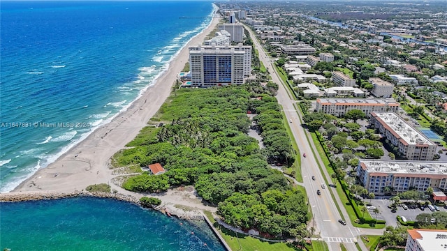 drone / aerial view with a view of the beach and a water view