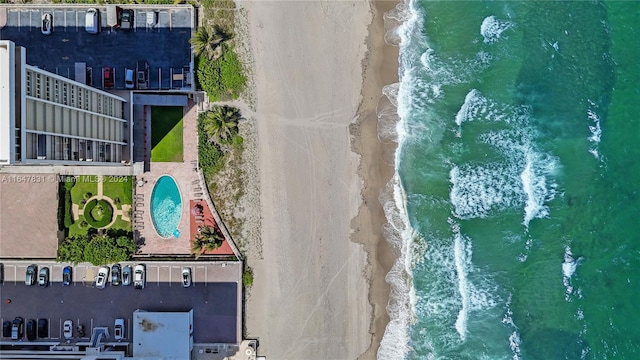 bird's eye view featuring a beach view and a water view