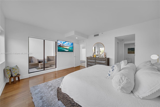 bedroom featuring a closet and wood-type flooring