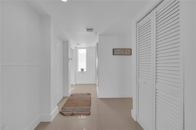 hallway with light tile patterned flooring