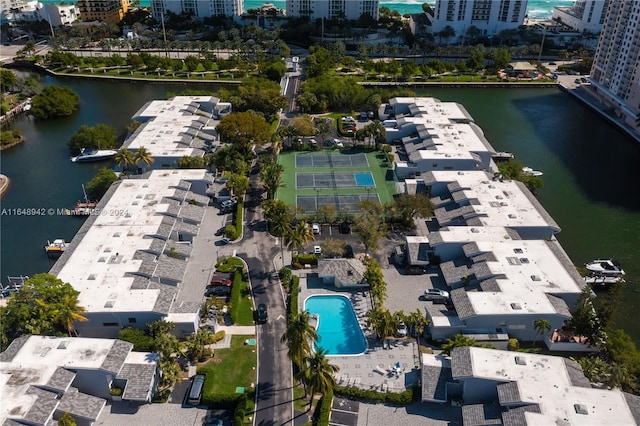 birds eye view of property with a water view