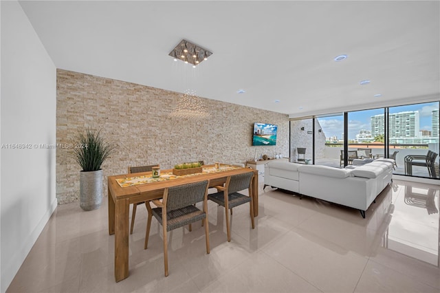 dining space featuring light tile patterned flooring