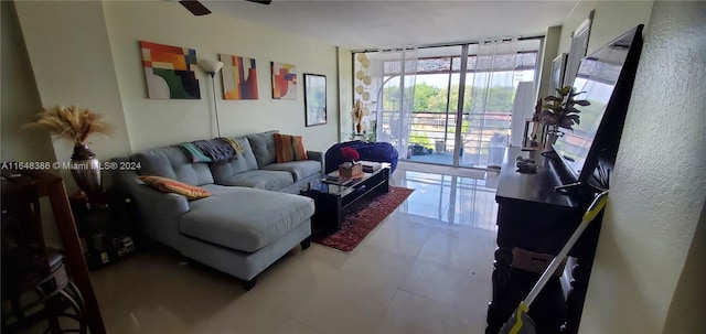 tiled living room featuring ceiling fan