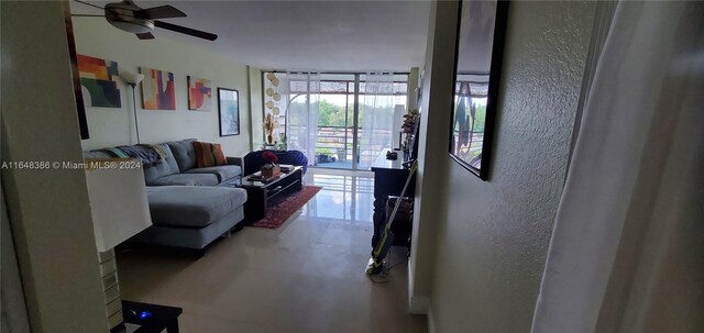 tiled living room with ceiling fan