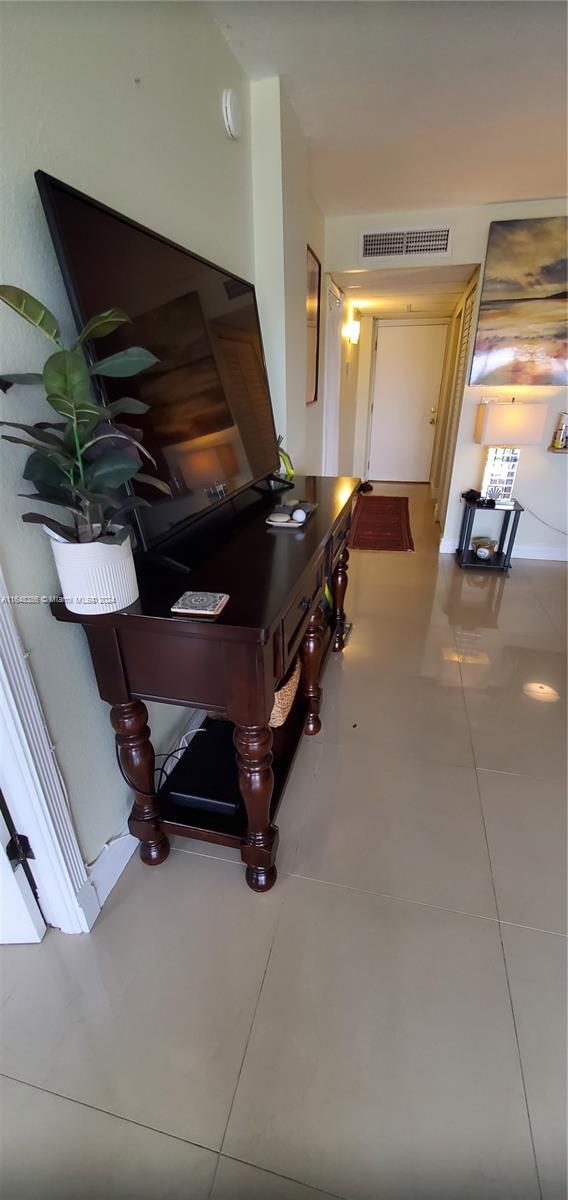 misc room with tile patterned flooring