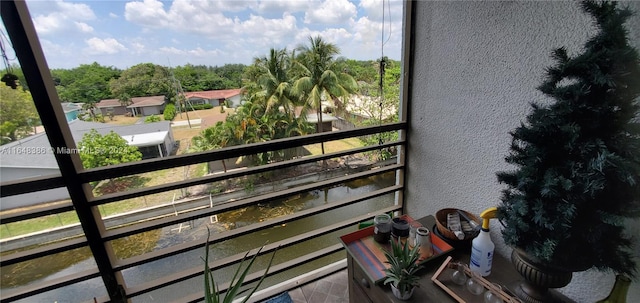 balcony featuring a water view