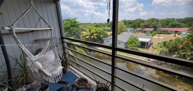 balcony featuring a water view