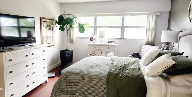 bedroom featuring dark hardwood / wood-style flooring