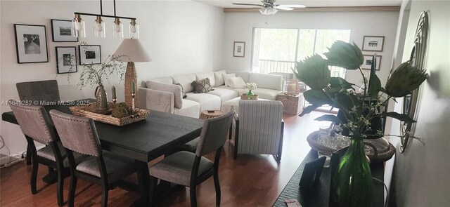 dining space with ceiling fan and dark hardwood / wood-style flooring