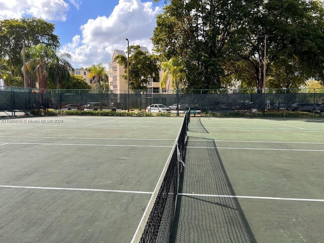 view of sport court with fence