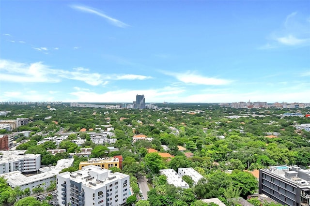 birds eye view of property with a view of city