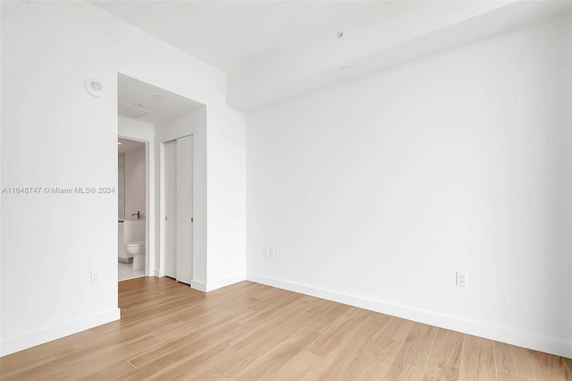 spare room with light hardwood / wood-style flooring