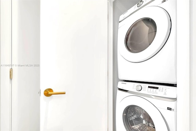 clothes washing area with stacked washer / drying machine