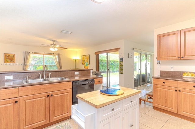 kitchen with wooden counters, dishwasher, sink, ceiling fan, and light tile patterned flooring