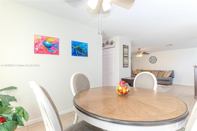 dining room featuring light tile patterned flooring and ceiling fan