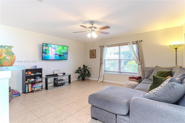 living room with light tile patterned floors and ceiling fan