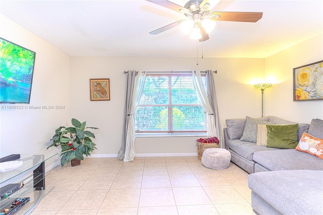 living room with ceiling fan and light tile patterned floors