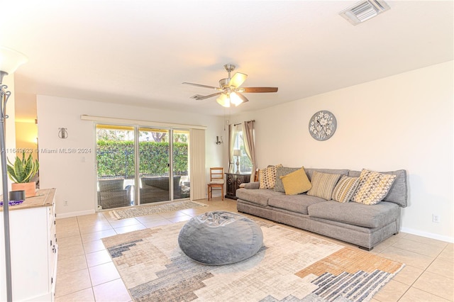 living room with ceiling fan and light tile patterned floors