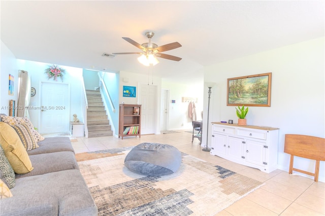 living room featuring ceiling fan and light tile patterned floors