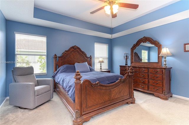 bedroom featuring ceiling fan and light colored carpet