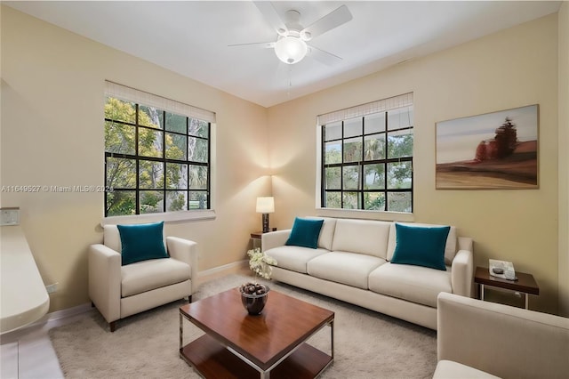 living room with a wealth of natural light and ceiling fan