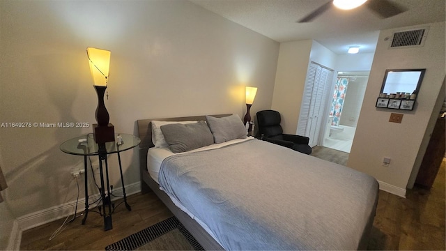 bedroom featuring ceiling fan, dark hardwood / wood-style floors, ensuite bath, and a closet