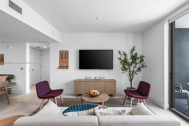 living room with light colored carpet