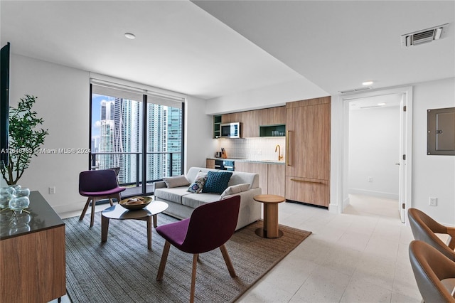 601 NE 1st Ave Unit 3101, Miami, FL 33132 - living area featuring baseboards, visible vents, electric panel, and light floors