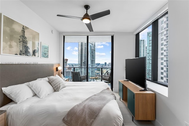 bedroom featuring access to exterior, ceiling fan, and light tile patterned floors