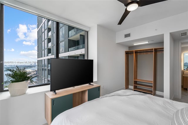 601 NE 1st Ave Unit 3101, Miami, FL 33132 - bedroom featuring baseboards, ceiling fan, and visible vents