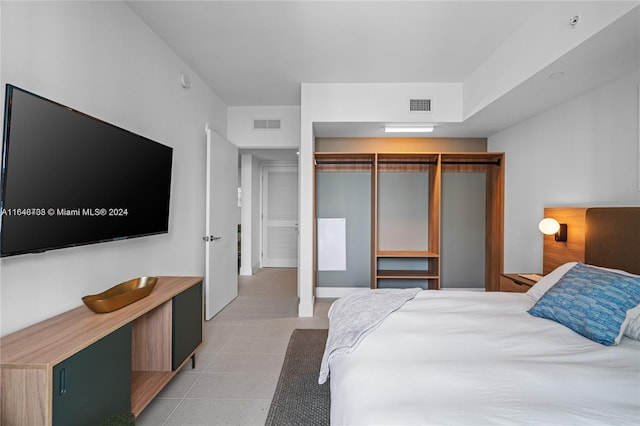 601 NE 1st Ave Unit 3101, Miami, FL 33132 - bedroom with a closet, visible vents, and light tile patterned floors