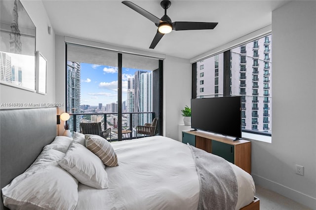 bedroom with multiple windows and ceiling fan