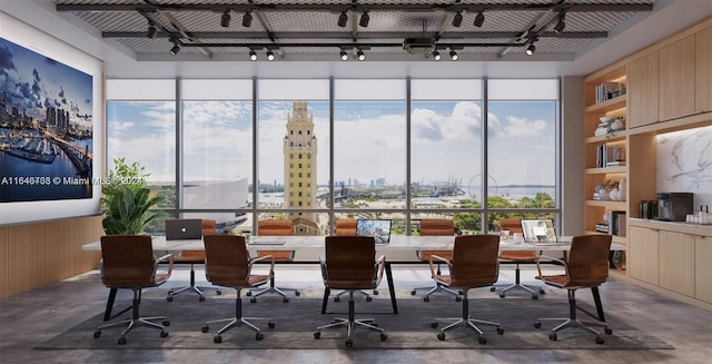 601 NE 1st Ave Unit 3101, Miami, FL 33132 - home office with a city view, rail lighting, finished concrete floors, and a healthy amount of sunlight